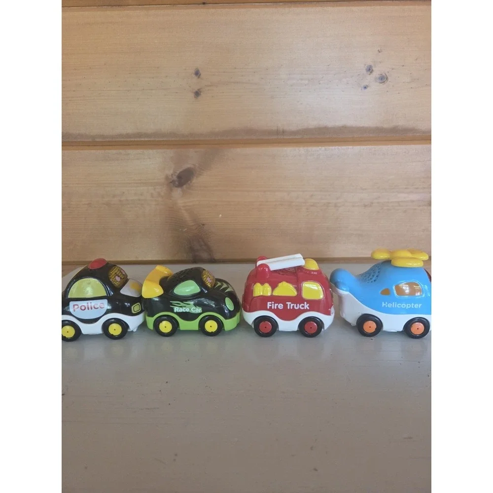 Lot of 4 VTech Go! Go! Smart Wheels Police Car Fire Truck Racecar Helicopter ZB4